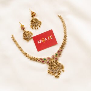 Gold Lakshmi Devi necklace with ruby and emerald stones and matching jhumkas – Karra De.