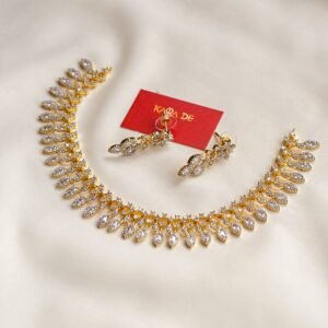 Gold leaf-design neckpiece with diamond stones and matching earrings – Karra De.